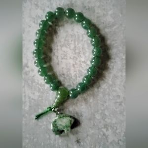 Green adventurine beaded power bracelet with polished stone bear totem.